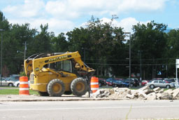 Kadlec Excavating John Deere skidloader breaking highway concrete. (close up)