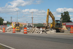 Kadlec Excavating backhoe and skidloaders working on Highway 65, Mora, project in front of Hardees and Chin's Garden.