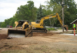 Kadlec Excavating backhoe and skid loader finalize culvert work.