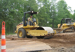 Kadlec Excavating packs dirt. (close up)