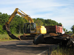 Pulling the old culvert out of the other side of the road.