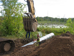 Kadlec Excavating crew attaches culvert union.