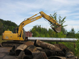 Kadlec Excavating places a shiny new culvert.