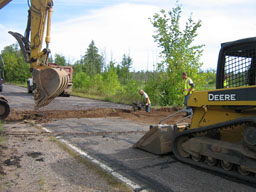 Kadlec Excavating fills the culvert trench with class 5.